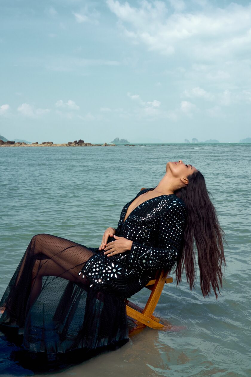 Black paisley hand embroidered jacket paired with a sheer net godet skirt