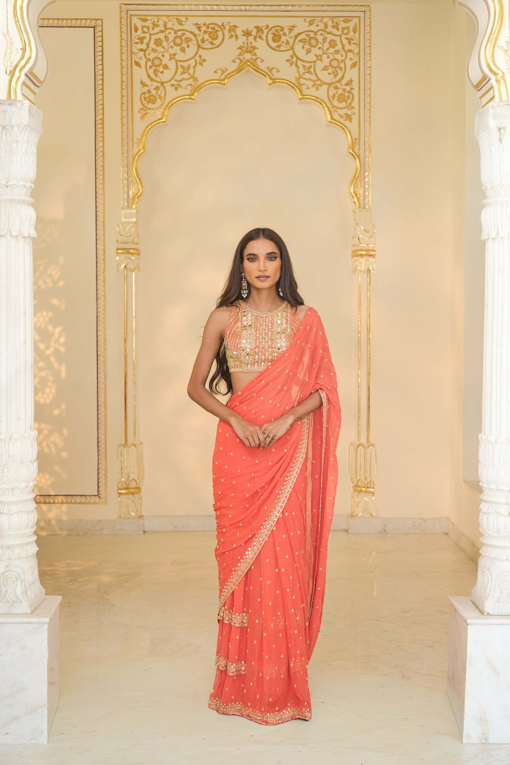 Warm coral hand embroidered tiered sari set