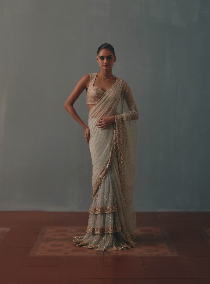 Ice blue & rose gold hand embroidered tiered net sari set