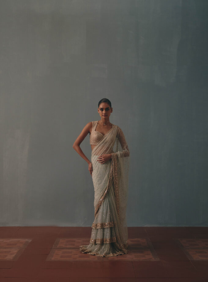 Ice blue & rose gold hand embroidered tiered net sari set