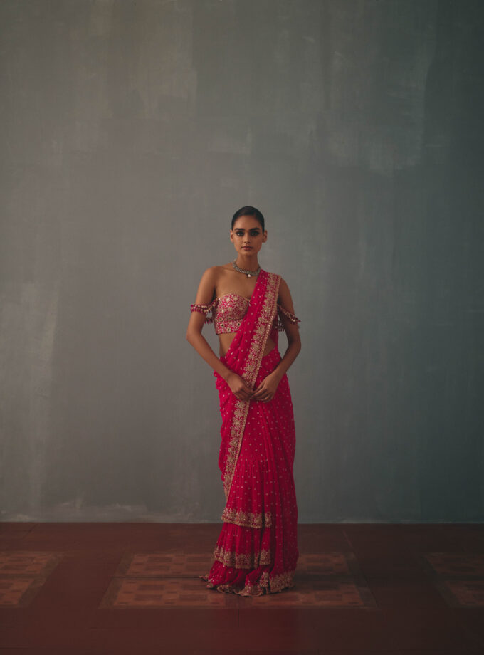 Rani pink & rose gold hand embroidered tiered sari & corset blouse set